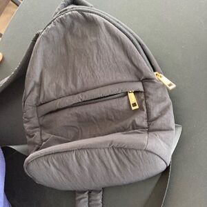 Stylish Black Backpack with Gold Accents